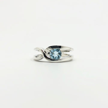 Bague rubans croisés topaze bleue